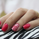 Red_nail_art_with_white_stripes